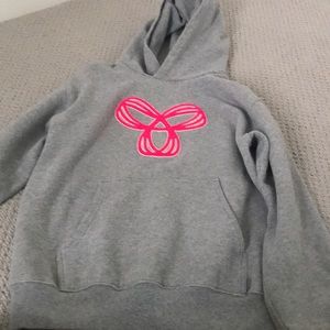 Gray aritzia hoodie with pink tna sign..